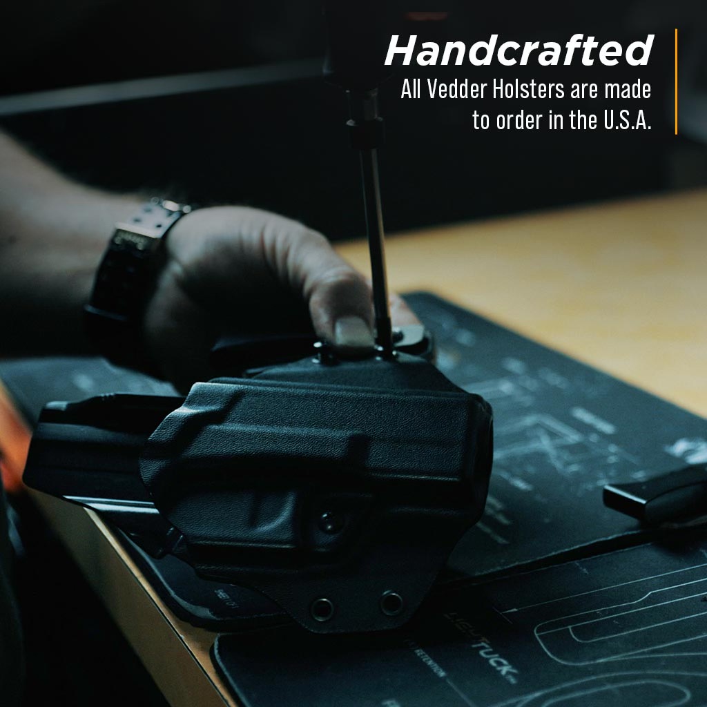 A Vedder Holster craftsman is assembling a ProTuck holster.