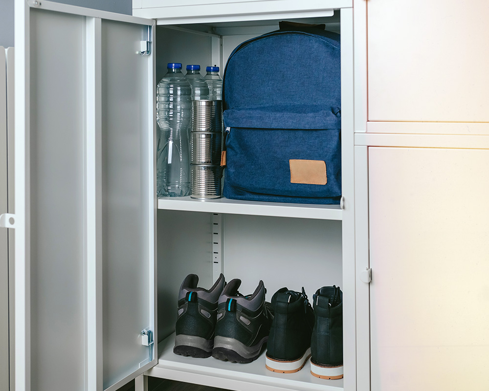 Storage space with water, a bug out bag and shoes