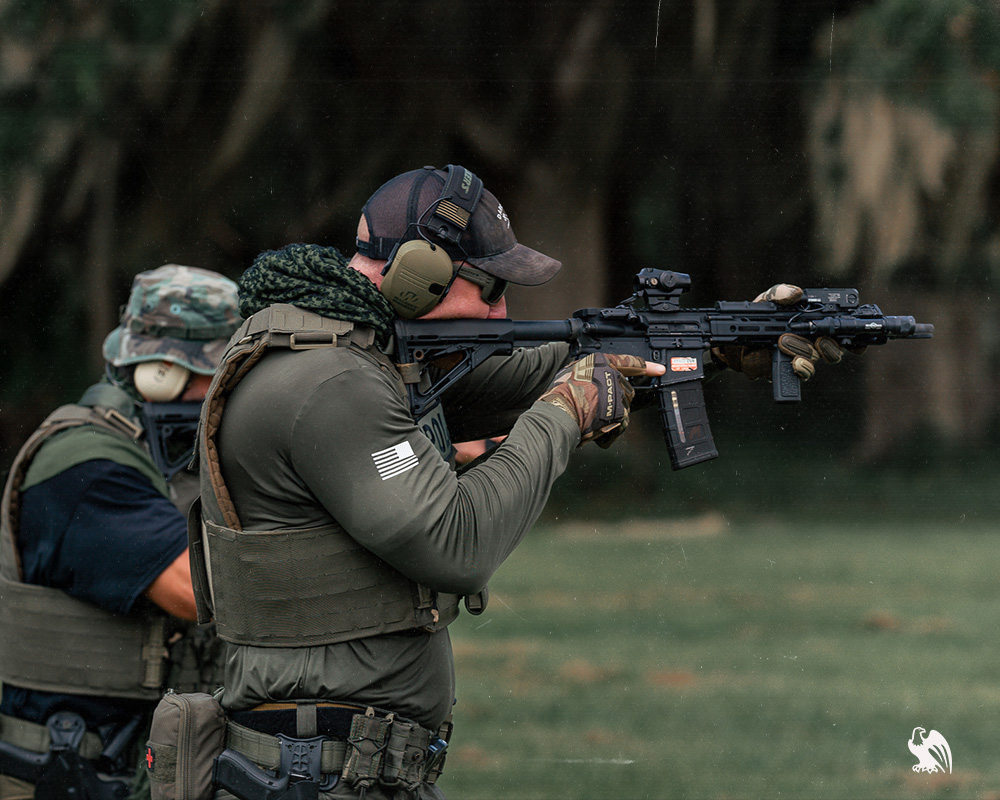 Military/Tactical men shooting with assault rifles at the shooting range