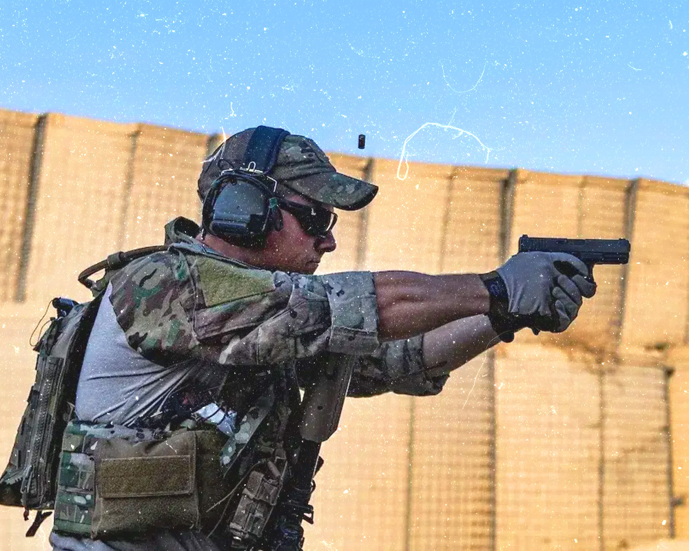 Tactical/Military man holding his gun ready to pull the trigger on his gun