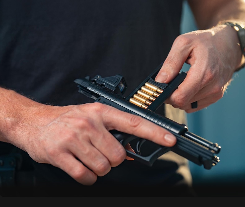 Man loading his Kel-Tec The PR57 Compact Pistol