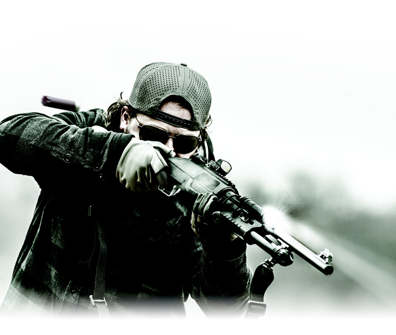 Man aiming down sight on a Benelli Nova 3 Tactical Pump Shotgun Series