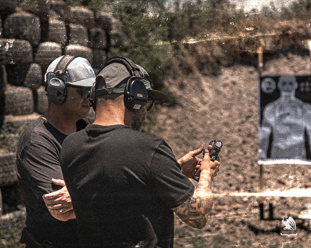 Joel ‘Tek’ Martinez teaching Vedder Holsters Manager on tips for shooting a handgun