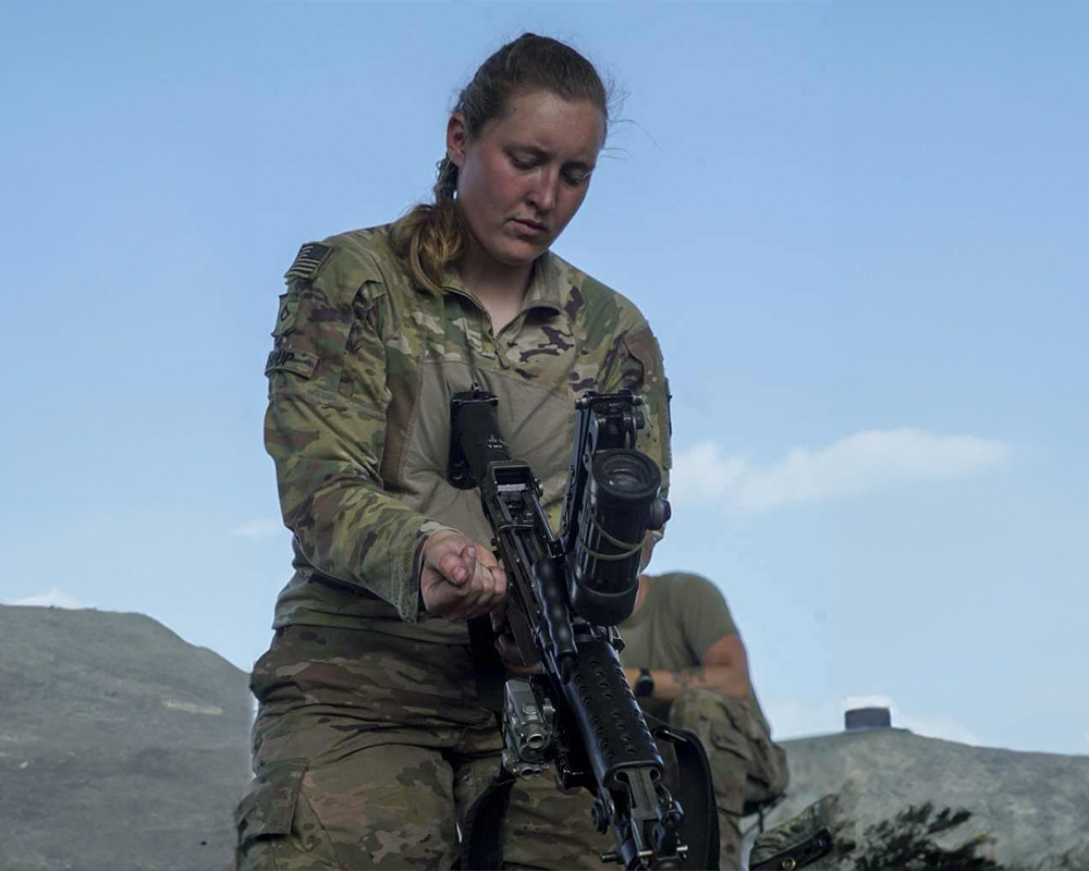 Annika Shoup a Female Infantry soldier holding an assault rifle.