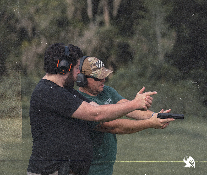 Firearms instructor showing how to hold a handgun correctly covering all the basics