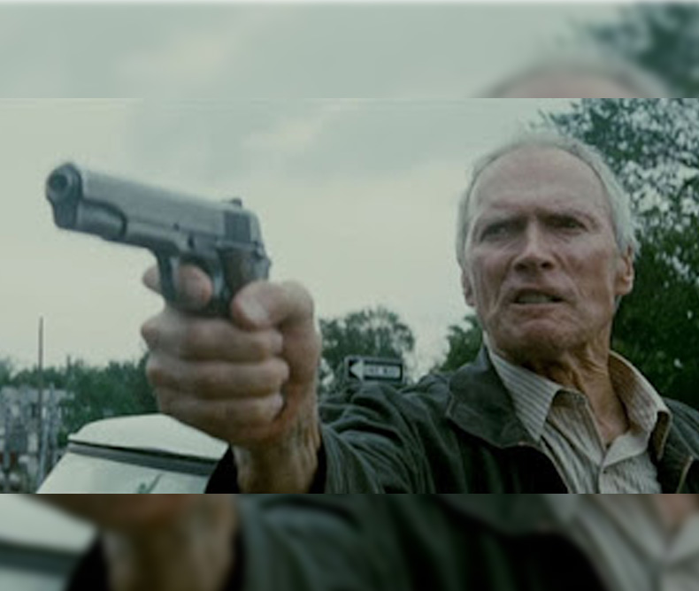 Clint Eastwood firing a Browning M1911 on the movie Gran Torino (2008)